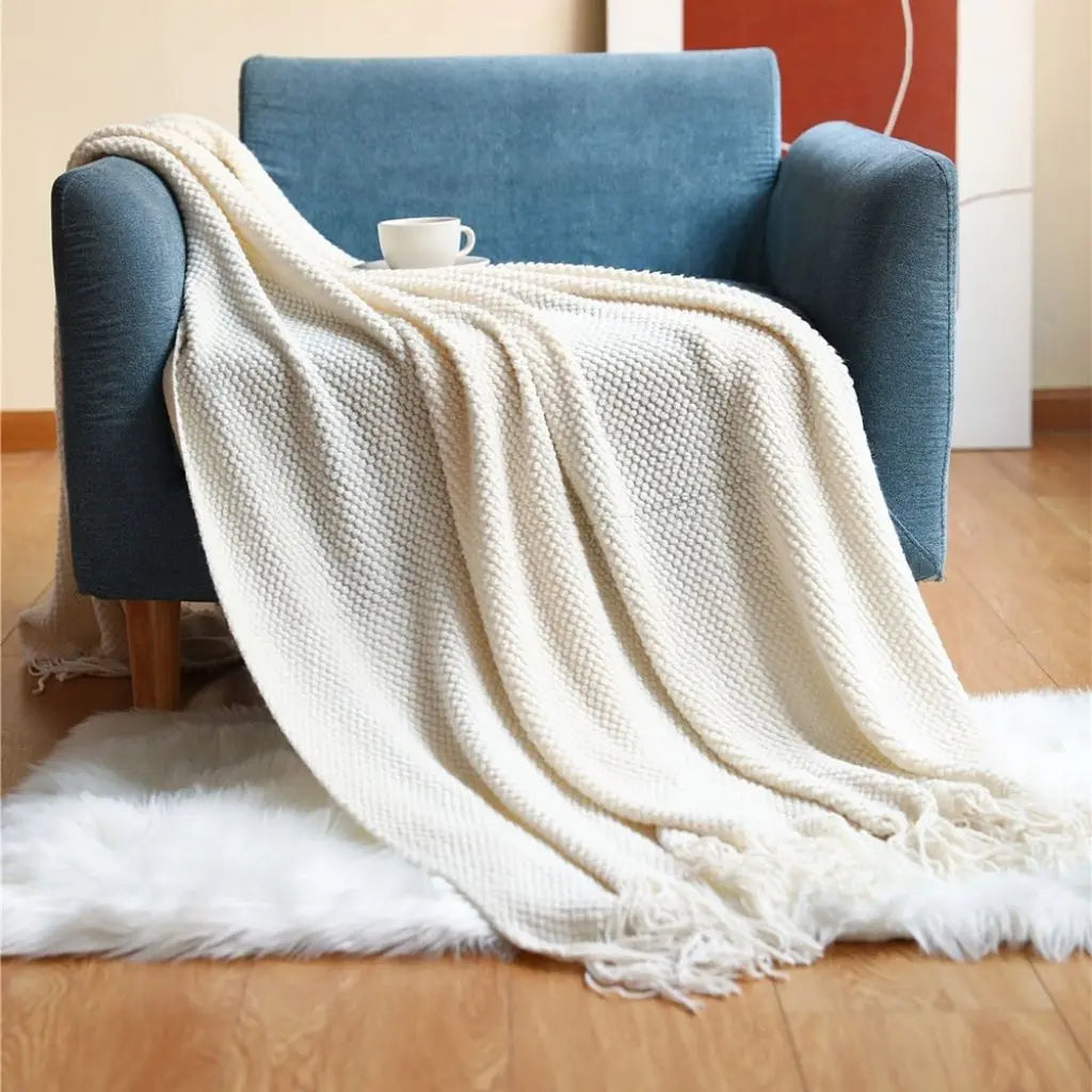 Tasseled Acrylic Knit Throw Blanket draped lifestyle
