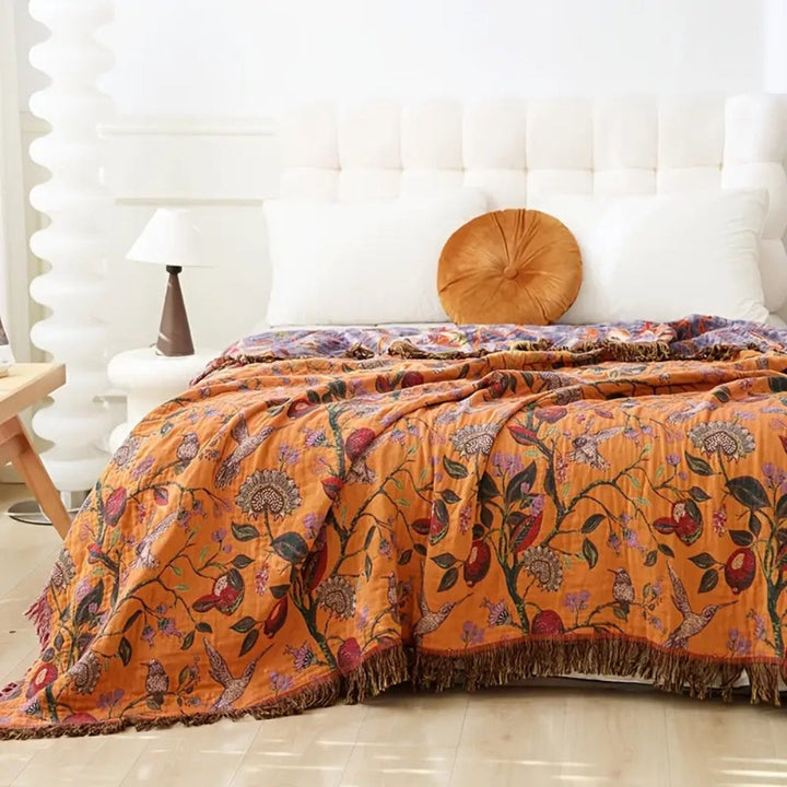 Wild Flora Tasseled Botanical Jacquard Cotton Throw on a bed