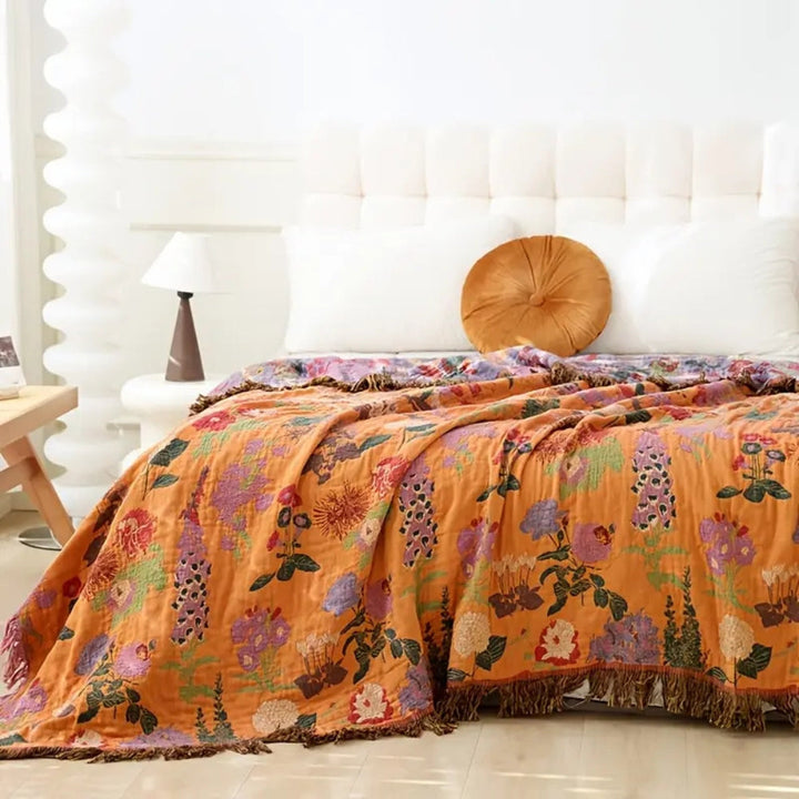 Wild Flora Botanical Jacquard Cotton Throw draped across a bed