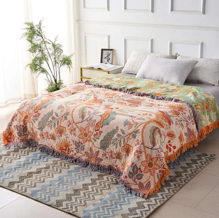 Multicolor floral cotton throw blanket draped, full view
