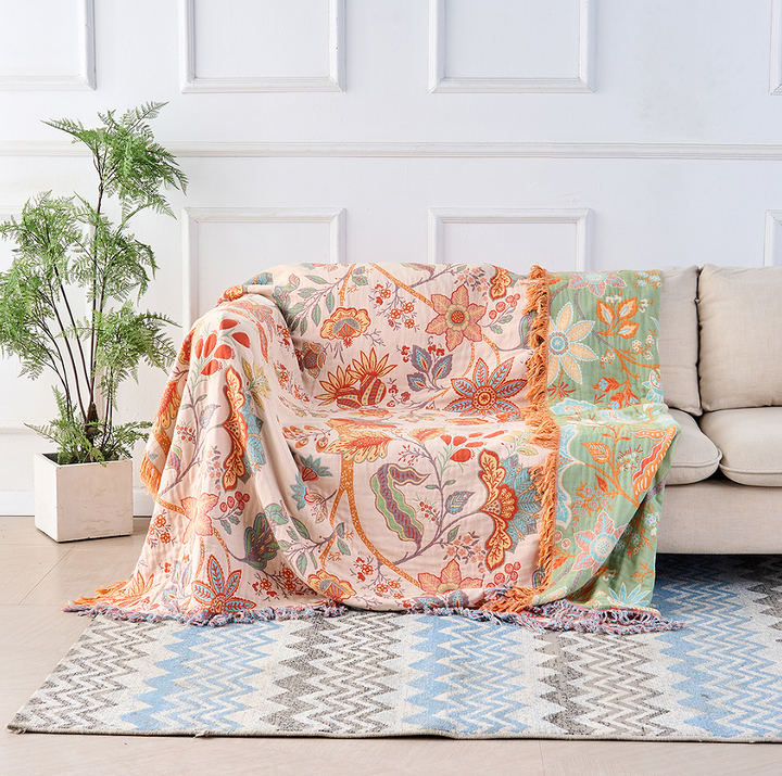 Multicolor floral cotton throw blanket, tassel edge close-up