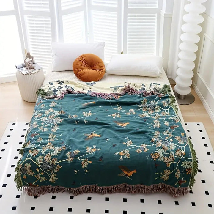 Dark and Green Beige Tasseled Ornamental Gauze Cotton Throw on a bed