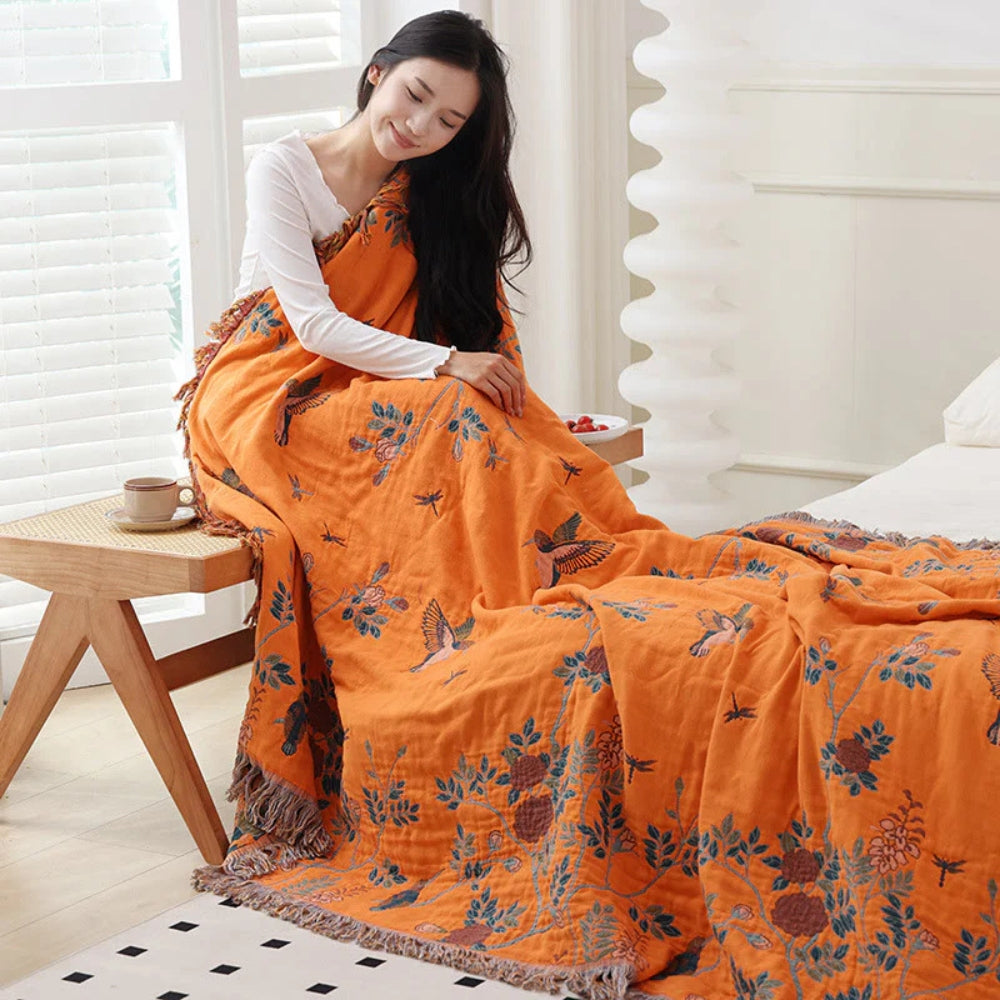 Dark Blue and Orange Ornamental Gauze Cotton Throw lifestyle on a bed