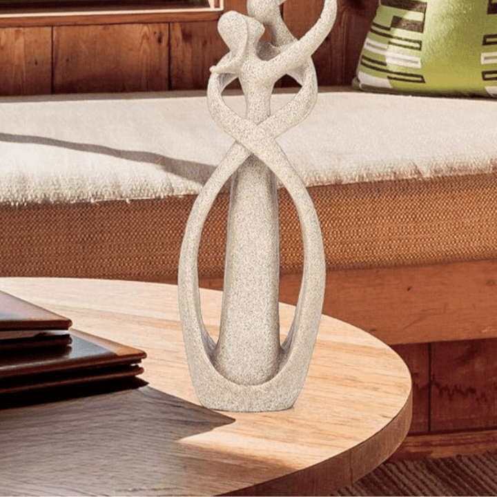 White Textured Ceramic Couple Sculpture on coffee table