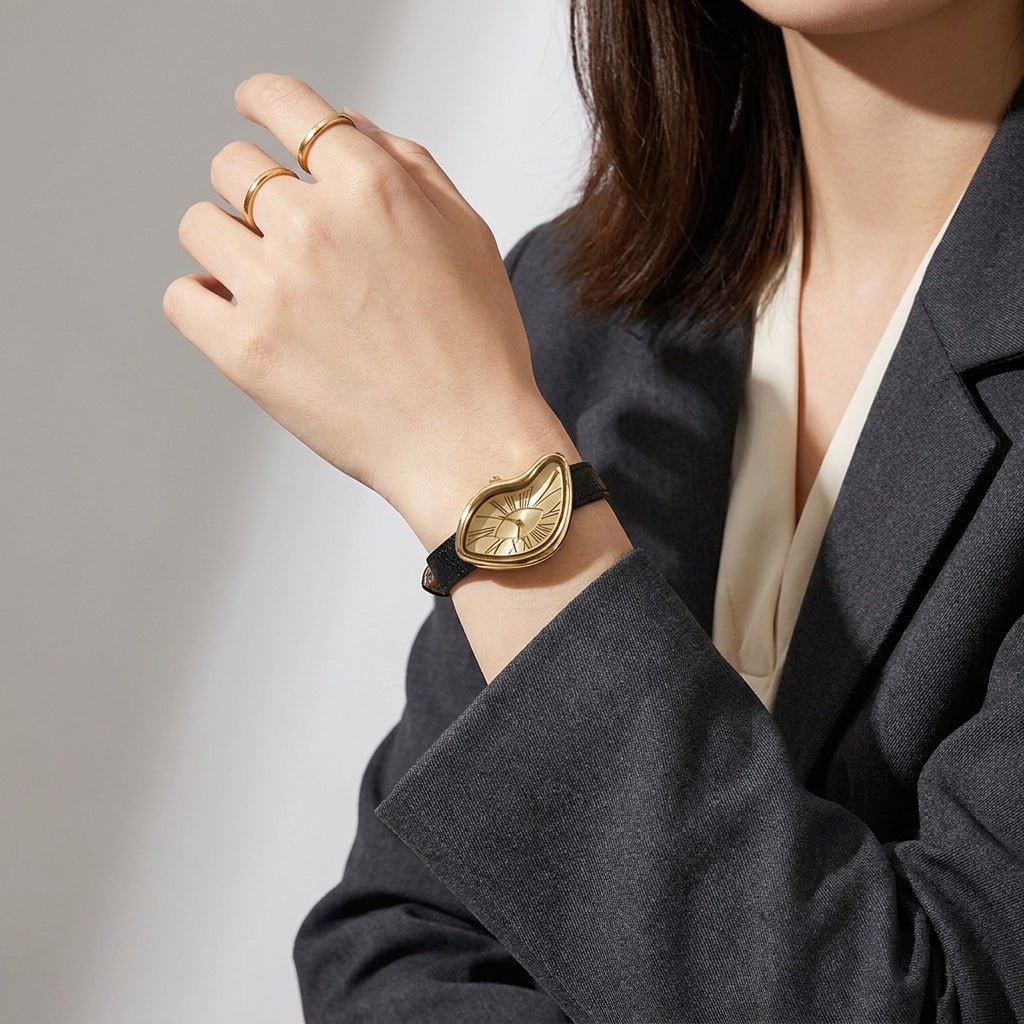 Twisted Gold-Tone Watch with black strap worn on wrist