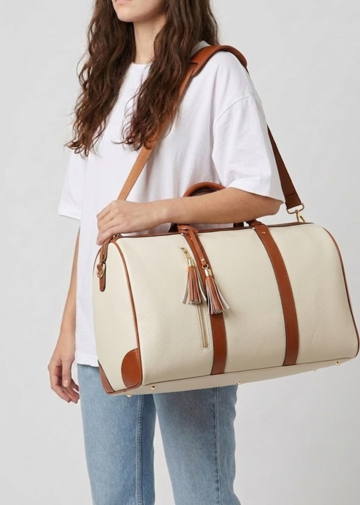Beige Vegan Leather Garment Duffel Bag carried by hand
