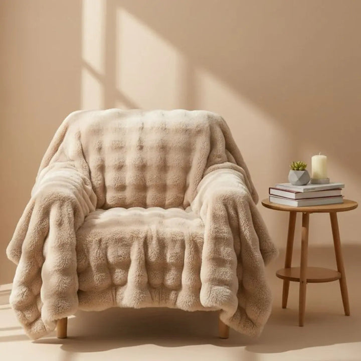 Velvet Angora Fur Throw Blanket draped over a bed