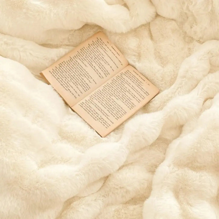 Velvet Angora Fur Throw Blanket on a sofa