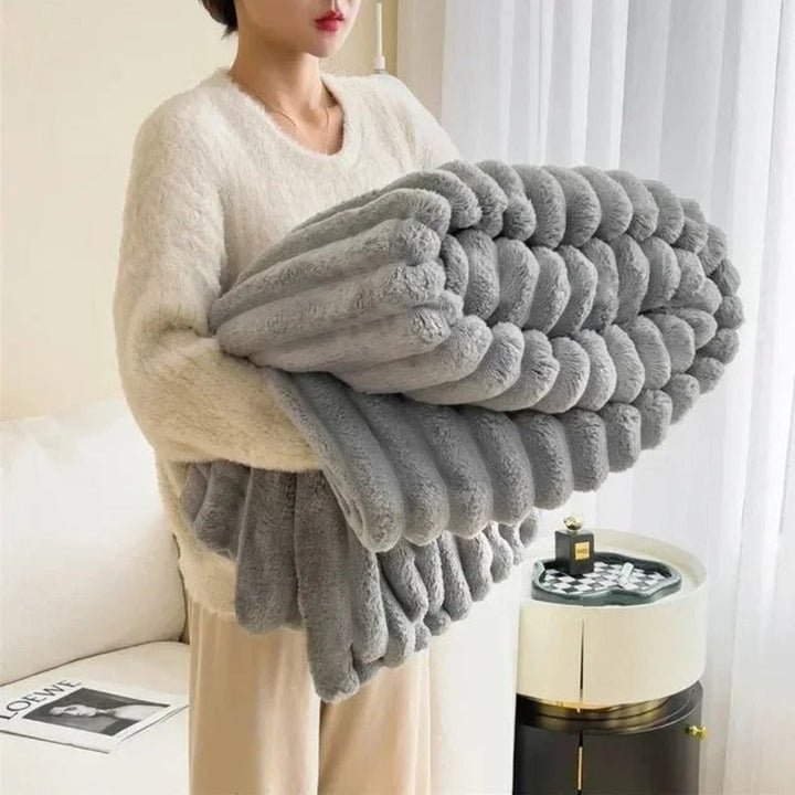 Light gray velvety microfleece throw blanket