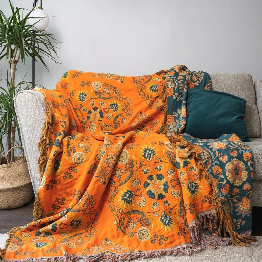 Vintage Marigold Cotton Gauze Throw over a sofa with cushions