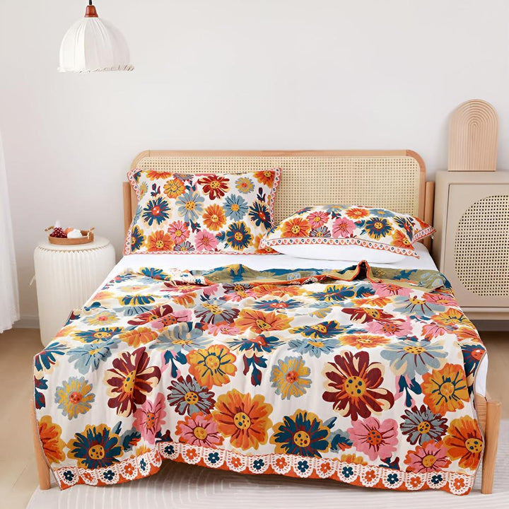 Vivid Floral Reversible Cotton Throw covering a bed