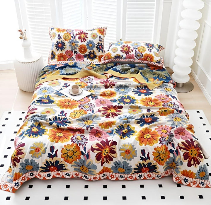 Vivid Floral Reversible Cotton Throw on a full bed