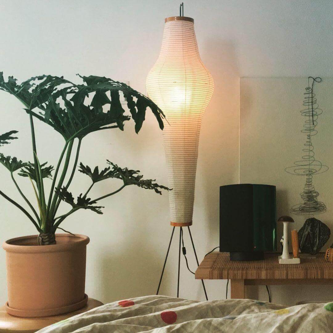 Washi Paper Column Floor Lamp beside potted plant