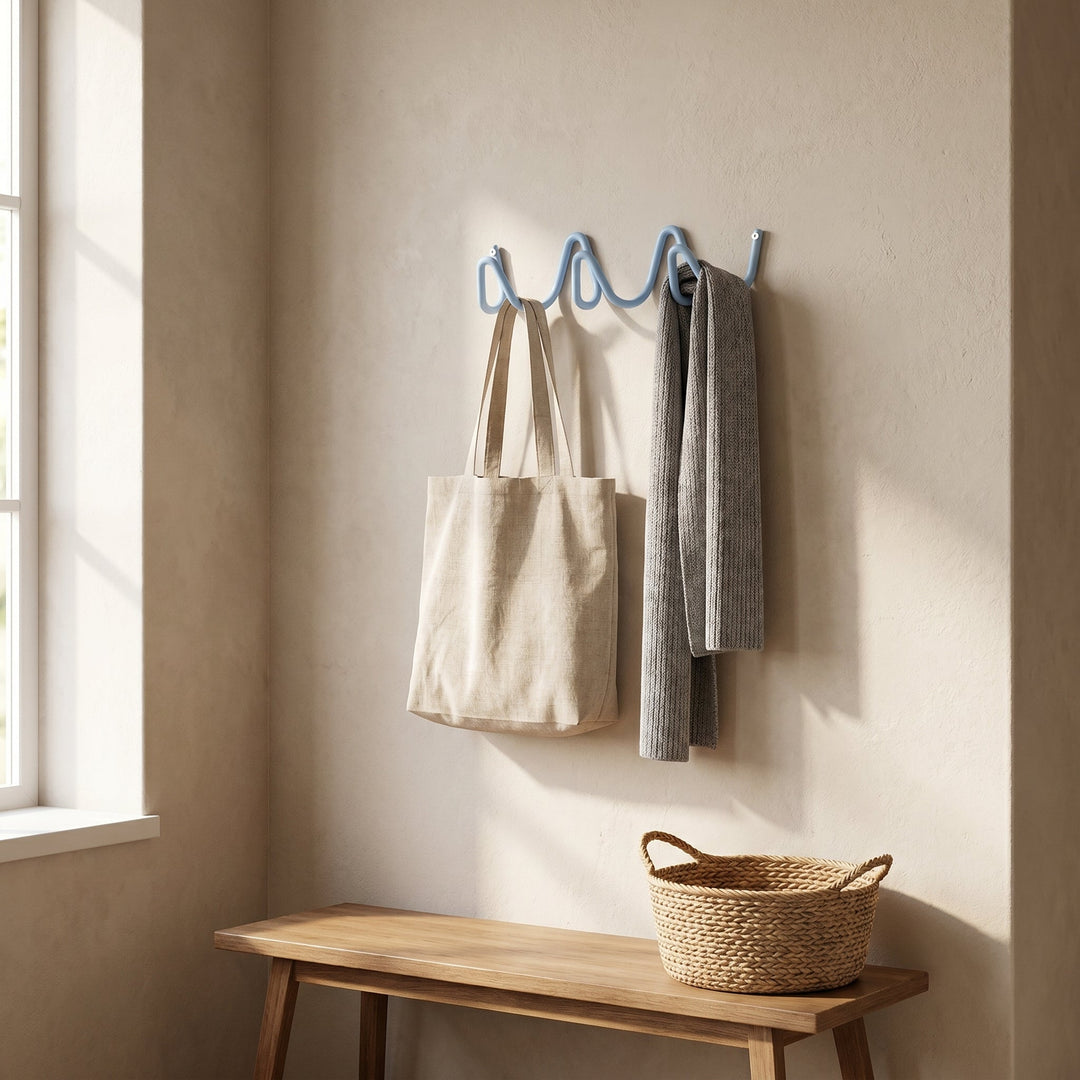 Blue Wavy Iron Wall Coat Hooks in entryway with bag and scarf
