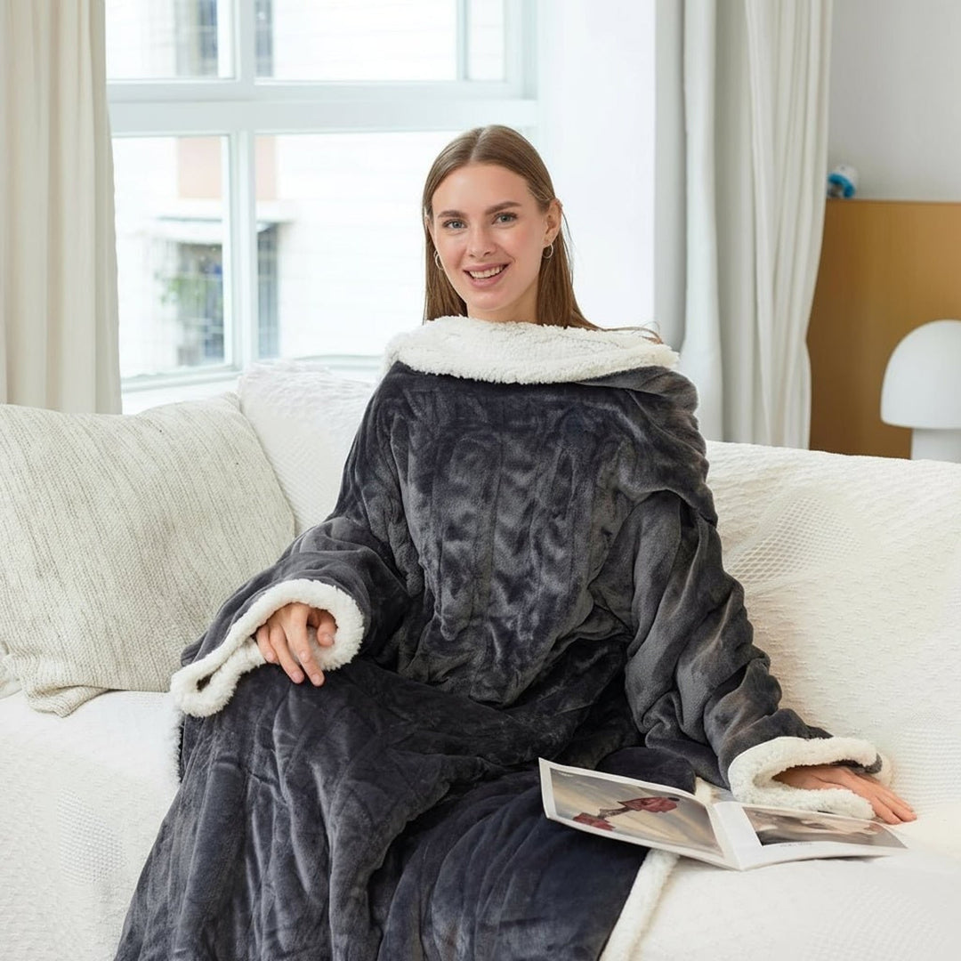 Dark grey wearable heated blanket worn while seated