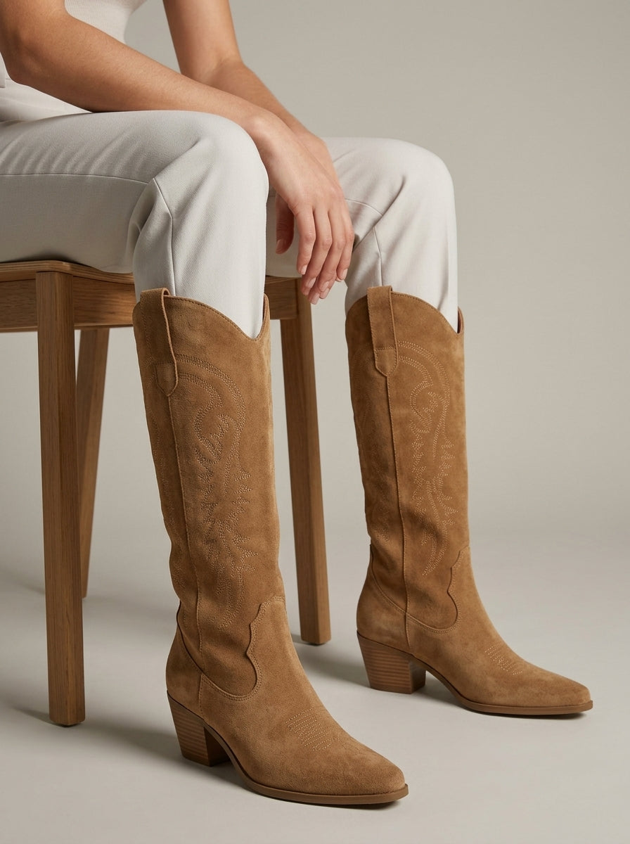 Khaki Western embroidered knee-high boots worn seated