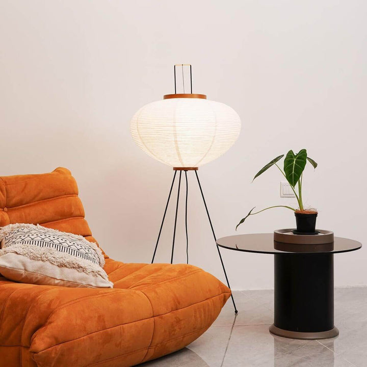 White Paper Floor Lamp beside orange chair lifestyle