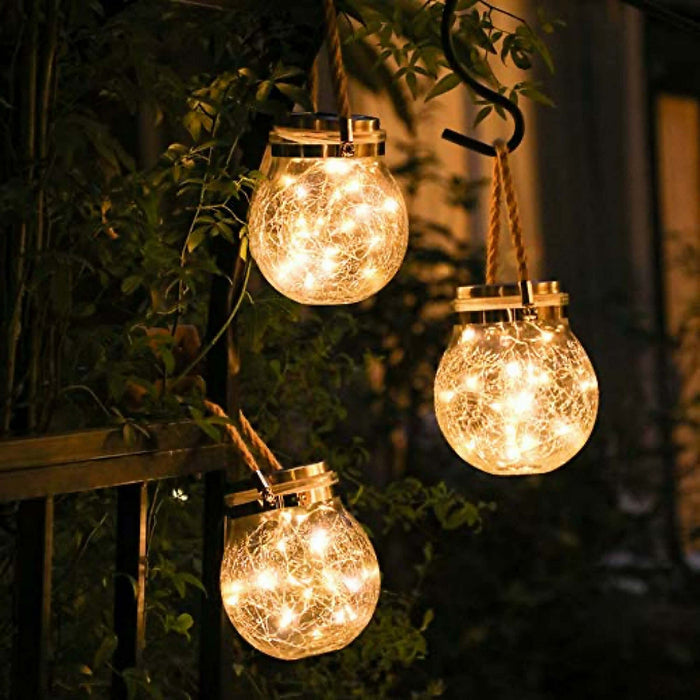 Glass Solar Lantern lit at dusk