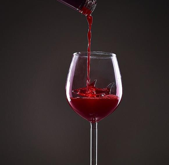 Lead-Free Crystal Shark Wine Glass with red wine being poured